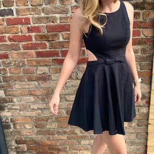 Black mini-dress with cutouts.